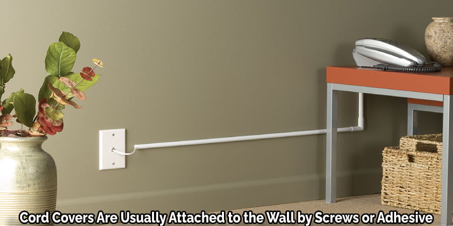 Cord Covers Are Usually Attached to the Wall by Screws or Adhesive