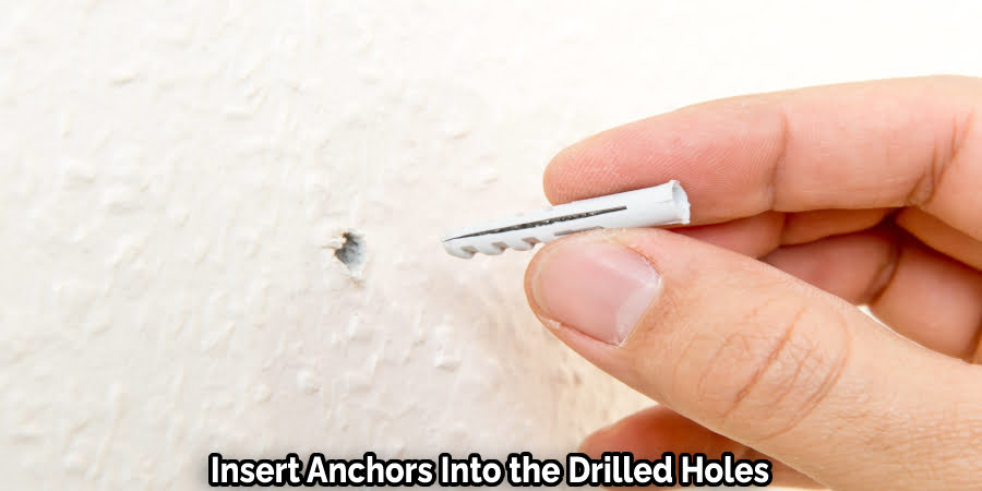 Insert Anchors Into the Drilled Holes