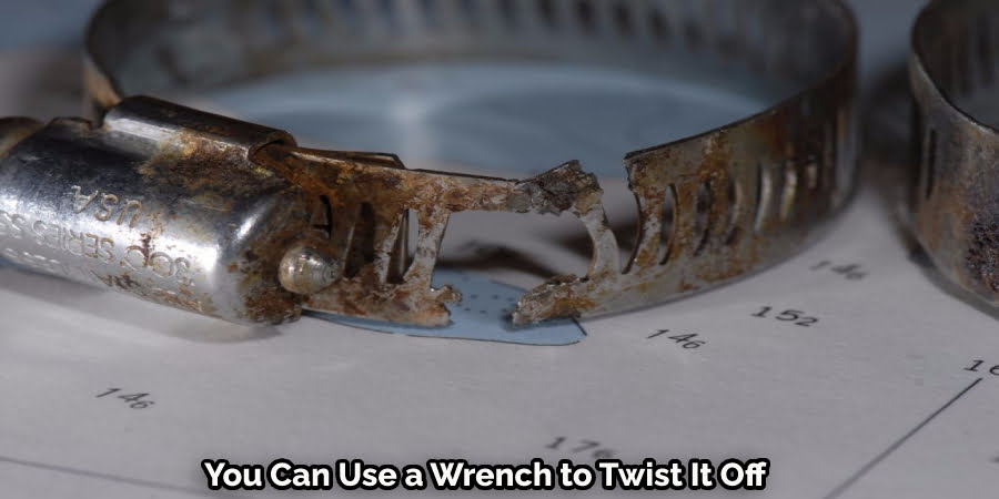 You Can Use a Wrench to Twist Off Rusted Hose Clamp