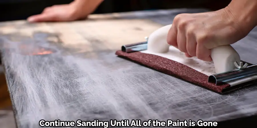 Continue Sanding Until All of the Paint is Gone